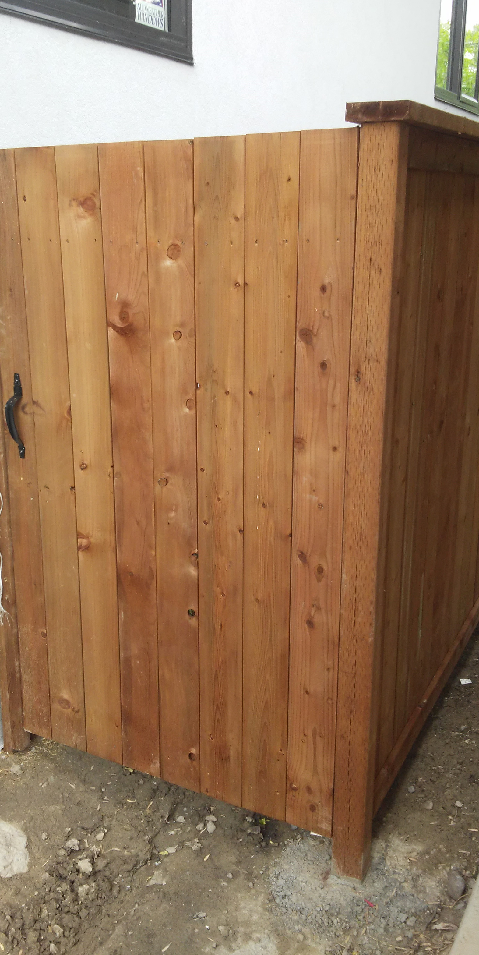 Simple wood gate!  Brown treated wood with black fence, gate hardware.