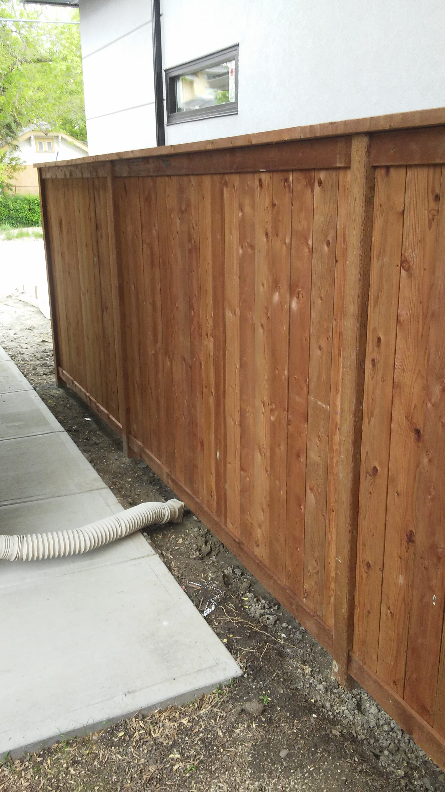 Modern -brown-pressure-treated-fence-professionally-installed-to-code